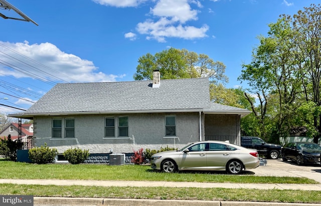 202 E Charleston, Lawnside, NJ 08045 - view of property exterior with stucco siding, a chimney, central air condition unit, and a shingled roof