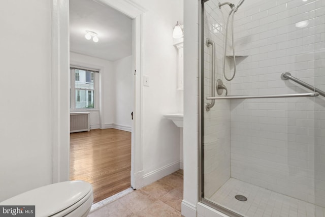 1514 17th St NW Unit 114, Washington, DC 20036 - bathroom featuring radiator and a shower stall