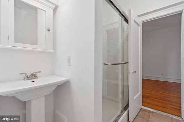 1514 17th St NW Unit 114, Washington, DC 20036 - full bathroom featuring a shower stall and a sink