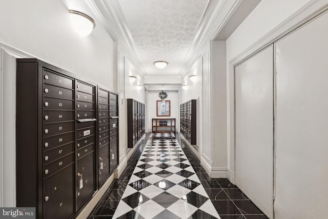 1514 17th St NW Unit 114, Washington, DC 20036 - corridor featuring ornamental molding, dark tile patterned floors, a textured ceiling, mail area, and inlaid floor details