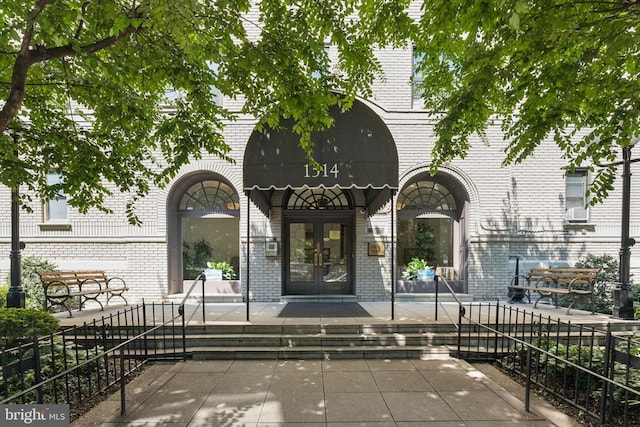 1514 17th St NW Unit 114, Washington, DC 20036 - doorway to property with brick siding, french doors, and cooling unit