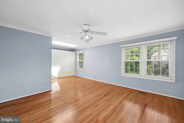 2893 Sutton Oaks Ln, Vienna, VA 22181 - empty room featuring light wood finished floors, crown molding, baseboards, and ceiling fan