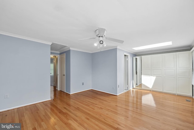 2893 Sutton Oaks Ln, Vienna, VA 22181 - empty room featuring ceiling fan, light wood-style flooring, attic access, crown molding, and baseboards