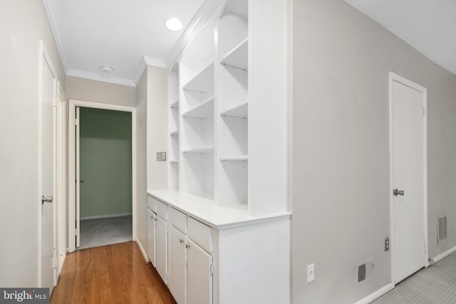 2893 Sutton Oaks Ln, Vienna, VA 22181 - hallway featuring ornamental molding, baseboards, and light wood-style flooring