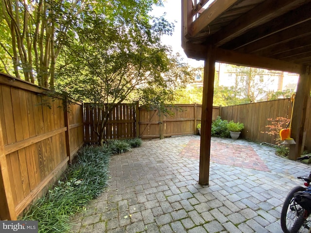2893 Sutton Oaks Ln, Vienna, VA 22181 - fenced backyard with a gate and a patio