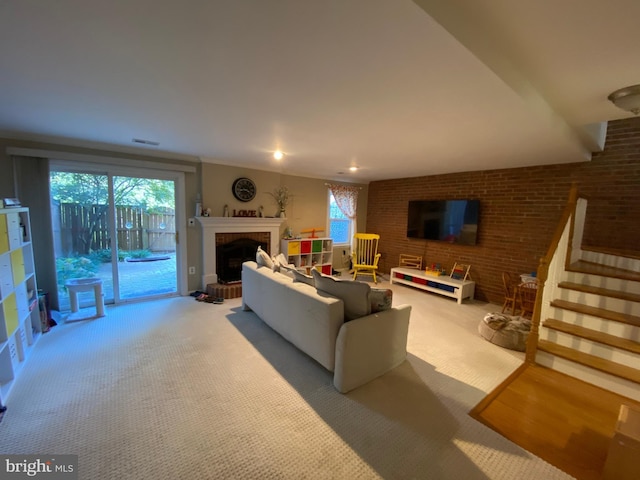 2893 Sutton Oaks Ln, Vienna, VA 22181 - carpeted living area featuring a fireplace with raised hearth, stairs, healthy amount of natural light, and brick wall