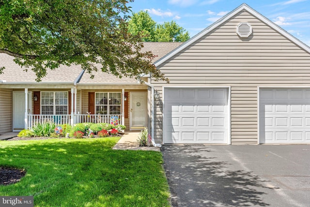 4 Hagarman Dr Unit 4, York, PA 17408 - ranch-style home with asphalt driveway, roof with shingles, a front yard, a garage, and covered porch