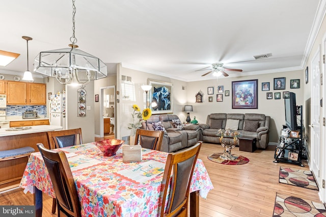 4 Hagarman Dr Unit 4, York, PA 17408 - dining room with ceiling fan, crown molding, light wood finished floors, and a chandelier