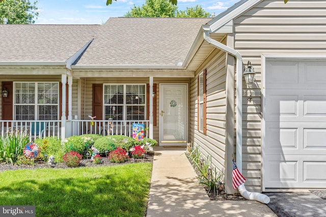 4 Hagarman Dr Unit 4, York, PA 17408 - property entrance with a garage, roof with shingles, and a porch