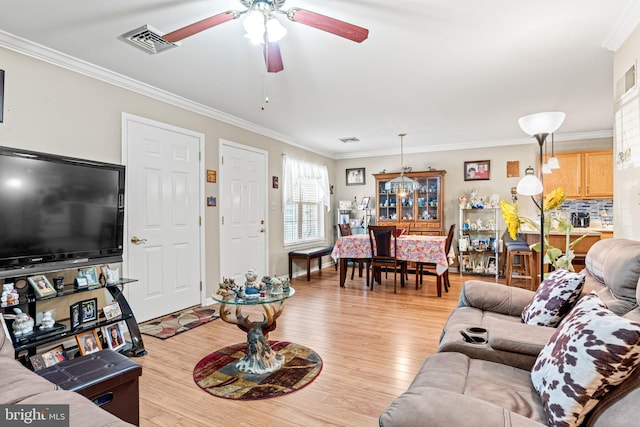 4 Hagarman Dr Unit 4, York, PA 17408 - living room featuring ornamental molding, a ceiling fan, and light wood-type flooring