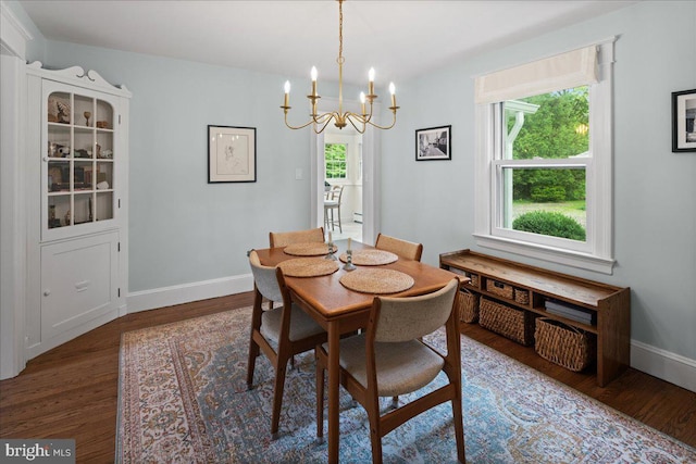 14 Willow Rd, Lawrenceville, NJ 08648 - dining area featuring a chandelier, wood finished floors, baseboards, and a baseboard heating unit