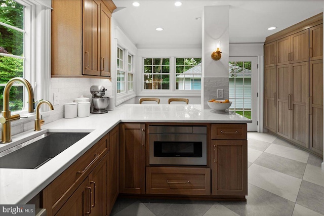 14 Willow Rd, Lawrenceville, NJ 08648 - kitchen with a sink, backsplash, healthy amount of natural light, light countertops, and recessed lighting