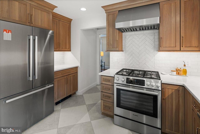 14 Willow Rd, Lawrenceville, NJ 08648 - kitchen featuring appliances with stainless steel finishes, wall chimney exhaust hood, decorative backsplash, brown cabinets, and light countertops