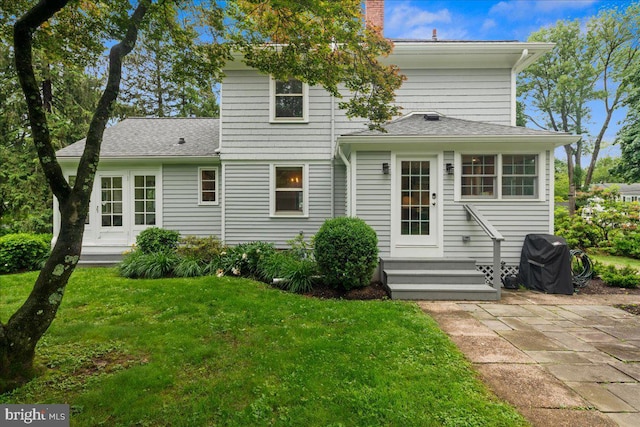 14 Willow Rd, Lawrenceville, NJ 08648 - rear view of property with a lawn, a chimney, a shingled roof, entry steps, and a patio area