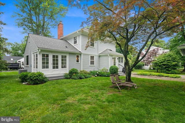 14 Willow Rd, Lawrenceville, NJ 08648 - back of house featuring a chimney, a lawn, cooling unit, and a shingled roof
