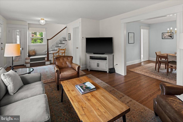 14 Willow Rd, Lawrenceville, NJ 08648 - living room with stairway, dark wood-style flooring, a chandelier, and baseboards