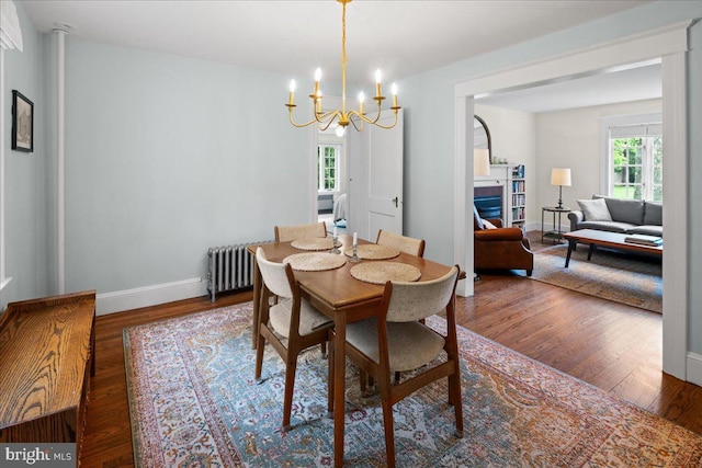 14 Willow Rd, Lawrenceville, NJ 08648 - dining area with radiator heating unit, wood finished floors, a chandelier, and baseboards