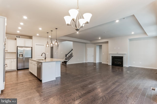33841 Joel Ln, Lewes, DE 19958 - kitchen with stainless steel appliances, open floor plan, dark wood-style flooring, a chandelier, and recessed lighting