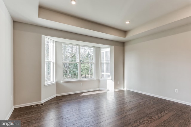 33841 Joel Ln, Lewes, DE 19958 - unfurnished room featuring dark wood finished floors, baseboards, recessed lighting, and a raised ceiling