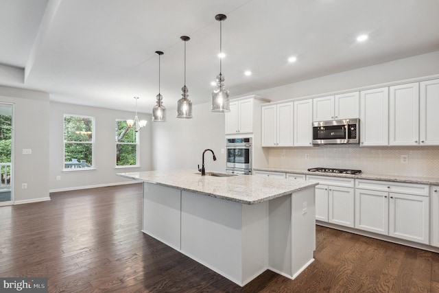 33841 Joel Ln, Lewes, DE 19958 - kitchen with stainless steel appliances, a sink, decorative backsplash, dark wood-style floors, and recessed lighting