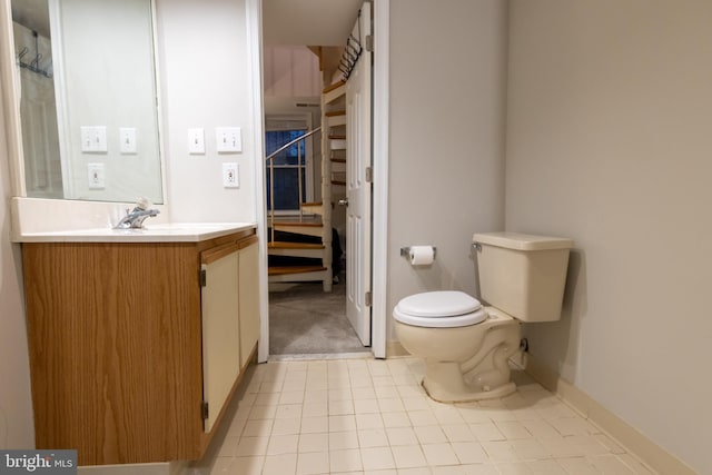 1731 Willard St NW Unit 102, Washington, DC 20009 - bathroom with toilet, vanity, tile patterned floors, and baseboards
