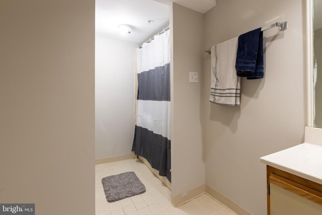 1731 Willard St NW Unit 102, Washington, DC 20009 - bathroom featuring vanity, tile patterned floors, a shower with curtain, and baseboards