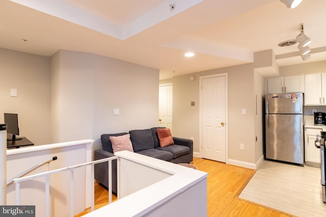 1731 Willard St NW Unit 102, Washington, DC 20009 - living area with light wood finished floors, recessed lighting, and baseboards
