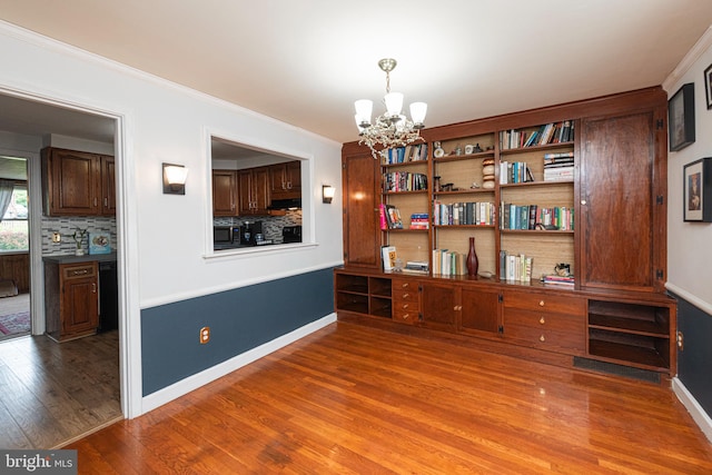 617 March St, Reading, PA 19607 - home office featuring a chandelier, wood finished floors, ornamental molding, and baseboards