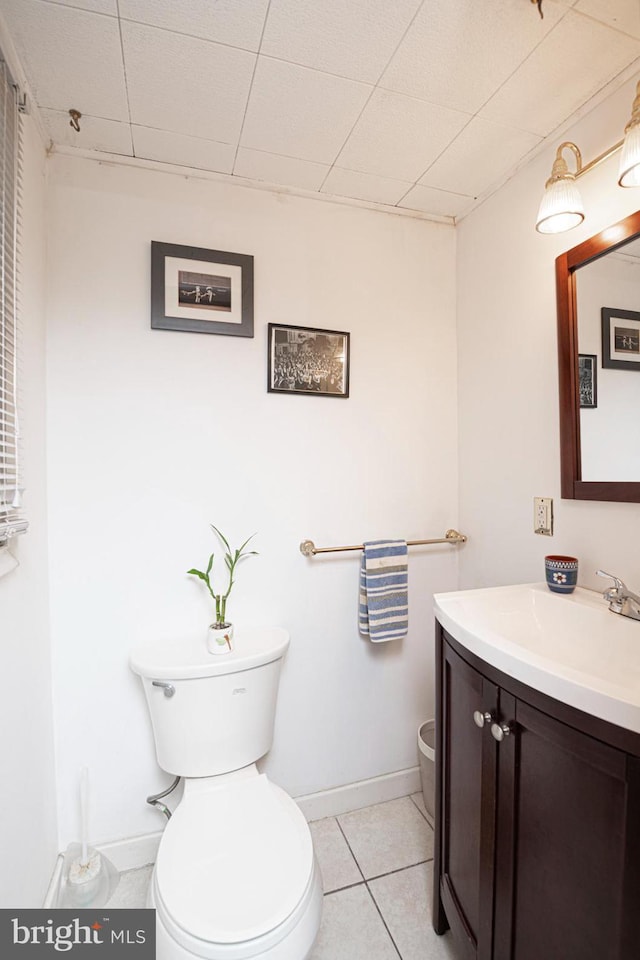 617 March St, Reading, PA 19607 - bathroom with toilet, vanity, baseboards, and tile patterned flooring