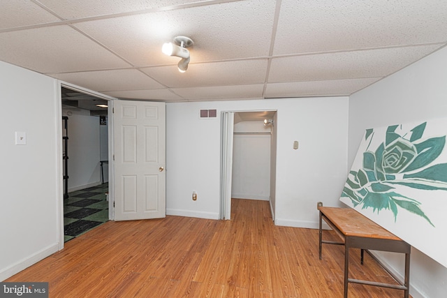 617 March St, Reading, PA 19607 - bedroom featuring a spacious closet, a drop ceiling, light wood finished floors, a closet, and baseboards