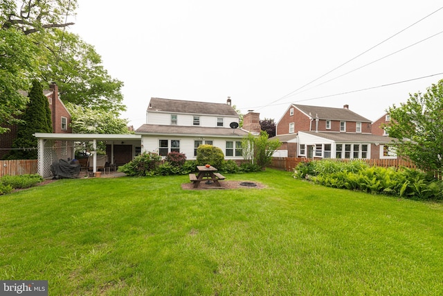 617 March St, Reading, PA 19607 - rear view of property with an outdoor fire pit