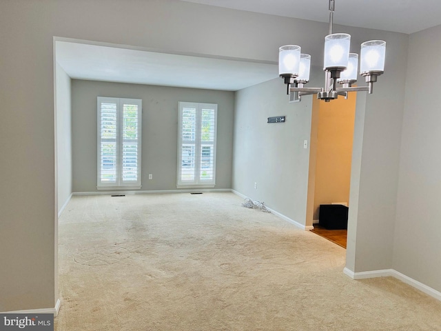 5431 Plymouth Meadows Ct, Fairfax, VA 22032 - spare room with carpet floors, baseboards, and a chandelier