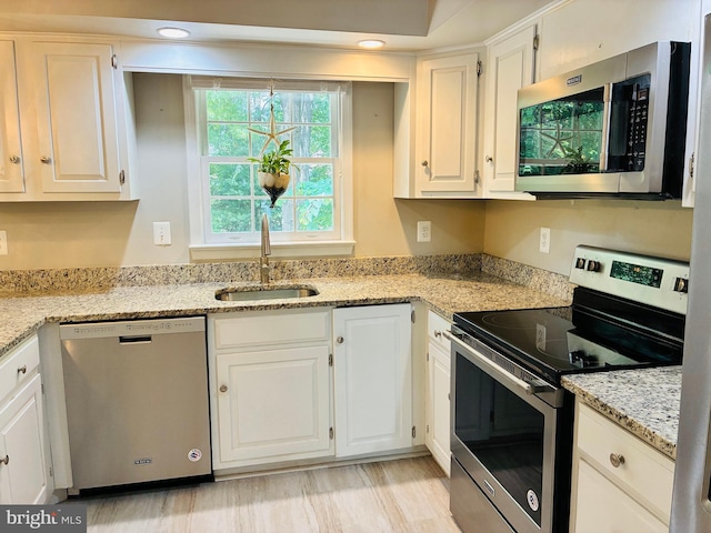 5431 Plymouth Meadows Ct, Fairfax, VA 22032 - kitchen with appliances with stainless steel finishes, a sink, and white cabinets