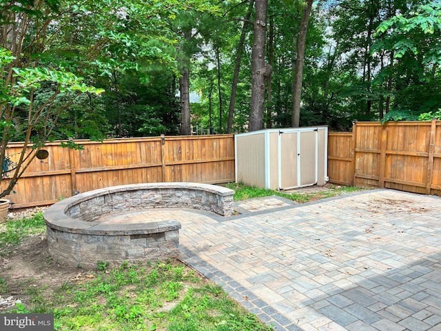 5431 Plymouth Meadows Ct, Fairfax, VA 22032 - fenced backyard with a patio area and an outdoor fire pit