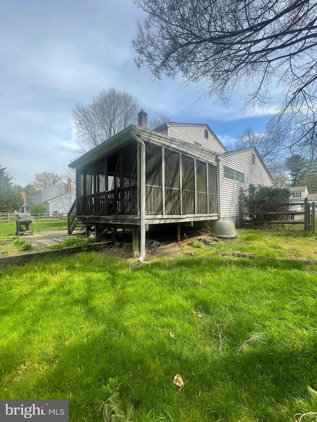 6066 Camelback Ln, Columbia, MD 21045 - back of property featuring a sunroom and a chimney