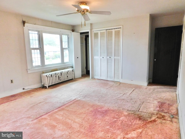 1216 23rd Ave, Altoona, PA 16601 - unfurnished bedroom with radiator heating unit, carpet floors, baseboards, and multiple closets