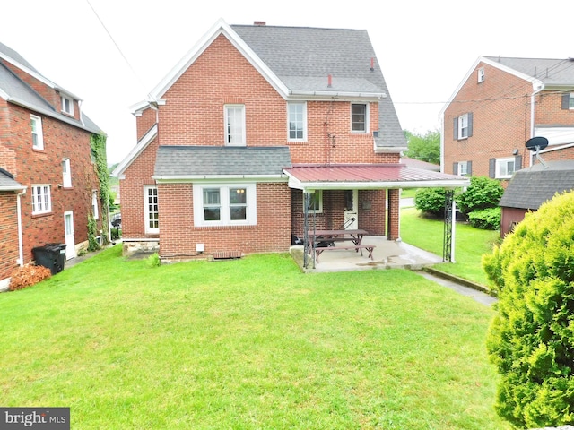 1216 23rd Ave, Altoona, PA 16601 - rear view of house featuring brick siding, a lawn, a patio, and a shingled roof