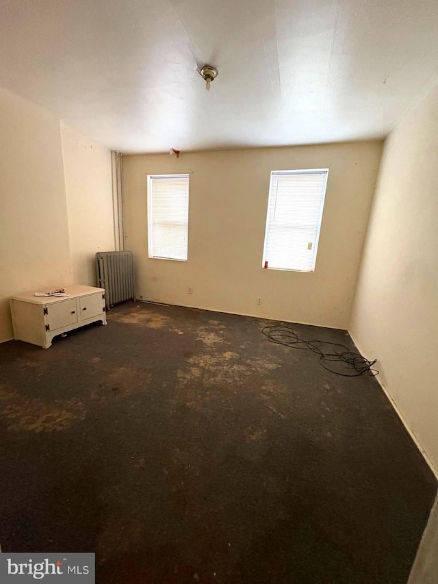 21 E Silver St, Philadelphia, PA 19134 - unfurnished room with radiator and dark colored carpet