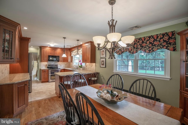 128 Cherry Ln, Doylestown, PA 18901 - dining room featuring a chandelier, ornamental molding, recessed lighting, and light wood-type flooring
