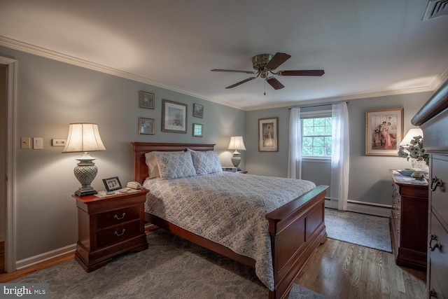 128 Cherry Ln, Doylestown, PA 18901 - bedroom featuring a baseboard heating unit, dark wood finished floors, baseboards, crown molding, and a ceiling fan