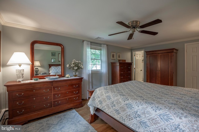 128 Cherry Ln, Doylestown, PA 18901 - bedroom featuring wood finished floors, crown molding, and ceiling fan
