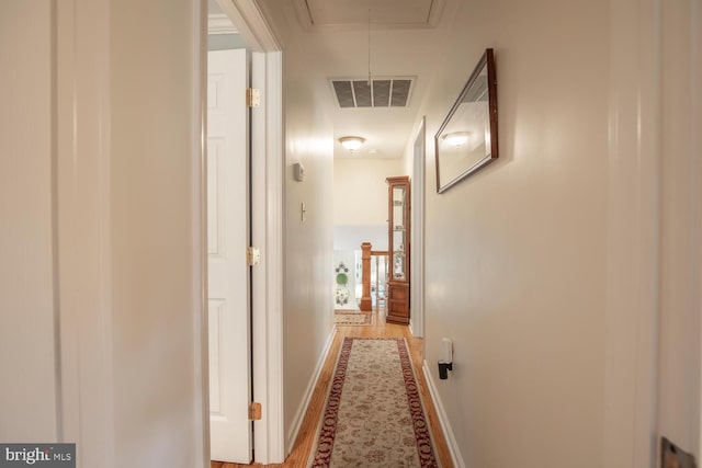 128 Cherry Ln, Doylestown, PA 18901 - corridor featuring attic access, baseboards, and light wood-style floors