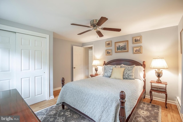 128 Cherry Ln, Doylestown, PA 18901 - bedroom featuring baseboards, light wood finished floors, a closet, and ceiling fan