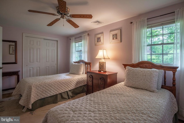 128 Cherry Ln, Doylestown, PA 18901 - bedroom featuring multiple windows, a closet, and a ceiling fan