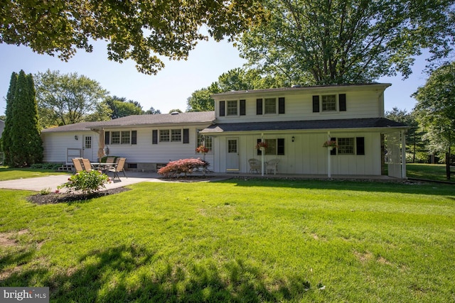 128 Cherry Ln, Doylestown, PA 18901 - view of front of home featuring a patio area, a front yard, and board and batten siding