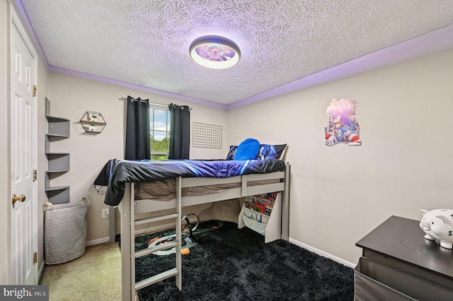 8924 Oxley Forest Ct, Laurel, MD 20723 - carpeted bedroom featuring baseboards and a textured ceiling