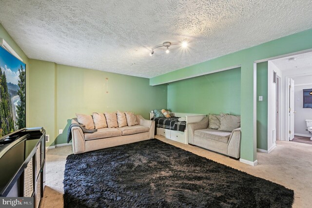 8924 Oxley Forest Ct, Laurel, MD 20723 - carpeted living room featuring a textured ceiling