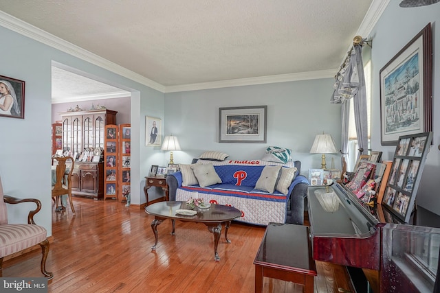618 Walden Way, Lumberton, NJ 08048 - living room with wood finished floors, a textured ceiling, crown molding, and baseboards