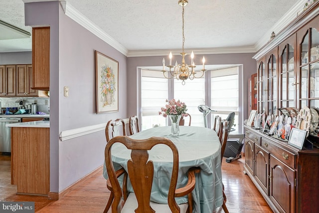 618 Walden Way, Lumberton, NJ 08048 - dining room with a chandelier, a textured ceiling, light wood-type flooring, crown molding, and baseboards