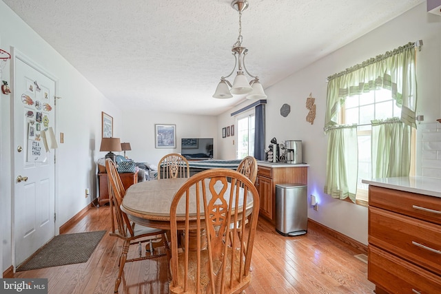 618 Walden Way, Lumberton, NJ 08048 - dining area featuring a textured ceiling, light wood finished floors, and baseboards